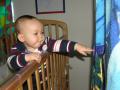 He can almost reach his curtain...