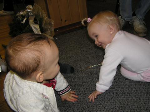 Sam flirting with a little girl at a Christmas party.