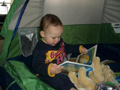 He likes to play in his tent.