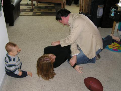 Alli and Doug wrestling...
